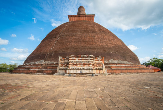 View of Jetavanaramaya in ancient city of Anuradhapura, Sri Lanka. Jetavanaramaya was the world's tallest stupa and a part belt tied by the Buddha is believed to be the relic that is enshrined here.
