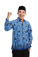 smiling asian young man wearing batik korpri with spirited hand gesture, formal uniform worker in...
