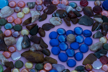 Obraz na płótnie Canvas Valentines heart of blue glass and polished stone.
