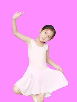 Happy Asian Ballet Dancer Girl In Pink Tutu Skirt Isolated On Purple Background.