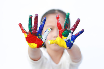 Little girl with colorful hands painted isolated on white background. Focus at child hands.