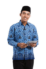asian young man wearing batik korpri using tablet digital, government officials of Indonesia