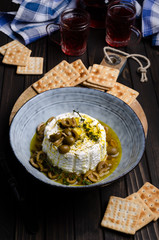 Soft cheese with olives