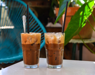 Glass cup of iced milk coffee