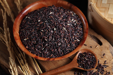 close up riceberry rice in measuring cup on table, riceberry rice in chinese kitchen background