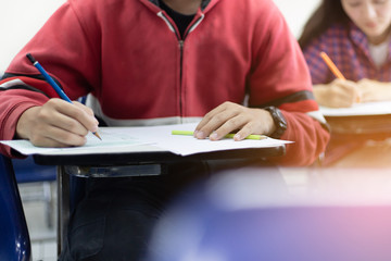 high school,university student study.hands holding pencil writing paper answer sheet.sitting...
