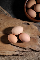 Group of of raw chicken eggs on rustic background, Organic eggs in loft style kitchen