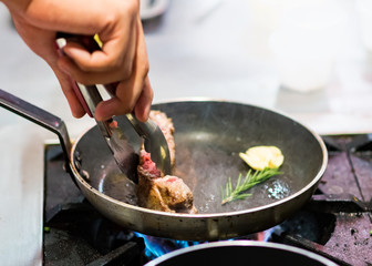 Chef cooking, Chef preparing food in the kitchen, Chef decorating dish, closeup.