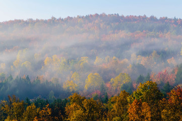 Morning sunrise during fall foliage season, Stowe, Vermont, USA