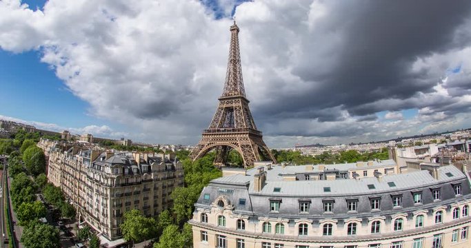 Eiffel Tower, elevated aerial view over rooftops, Paris, France, Europe - Time lapse