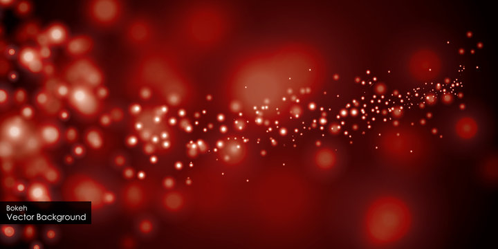 Blurred bokeh light on dark red background. Christmas and New Year holidays template.