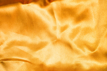 streak of golden fabric abstract background