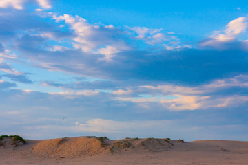 Wide blue cloudy sky over sand dunes. Stockton Sand Dunes near the coast, Worimi Regional Park, Anna Bay, Australia