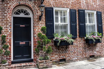 Fototapeta na wymiar old door and window on brick house