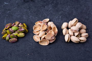 Pistachios (shelled, shells and whole) on slate