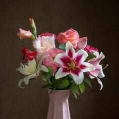 still life with summer flowers in vase on dark background