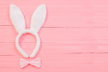 Easter decorations on pink wooden background