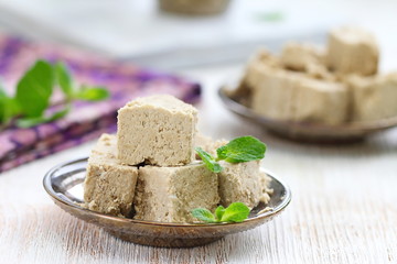 Sliced sunflower halva on the table. Delicious food.