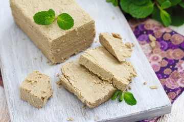 Sliced sunflower halva on the table. Delicious food.