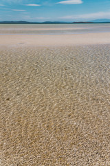 Fototapeta na wymiar view of Dunalley Beach in Tasmania, Australia with sandbanks and shallow pristine water