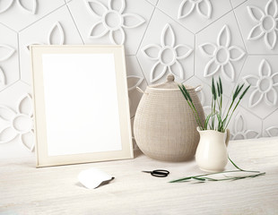 Mockup for presentation of picture or logo on white paper background. Decorated with rye green grass spikelets and wicker basket. Frame leans against flower white wall and stand on wooden table
