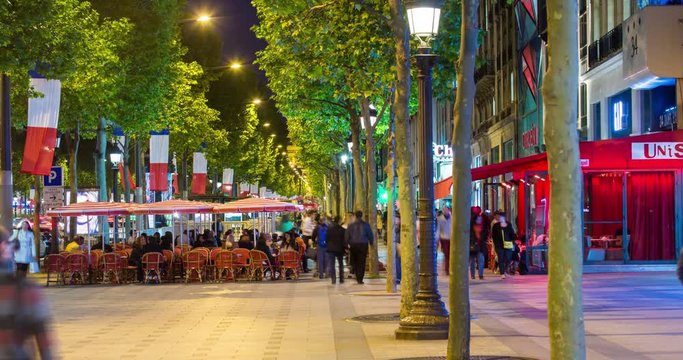 People sitting at a pavement cafe on the Champs Elysees avenue, Paris, France - time lapse