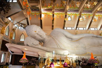 Large reclining Buddha marble statue for people and travelers travel visit and respect praying at...