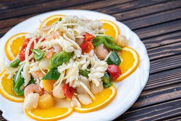 Shrimp in Warm Seafood Salad in a white plate