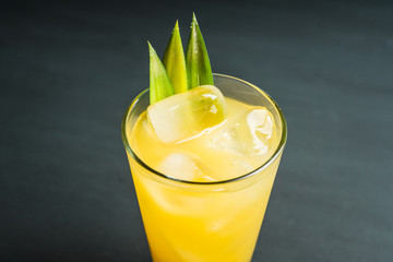 Pineapple cocktail in highball glass. Selective focus. Shallow depth of field.