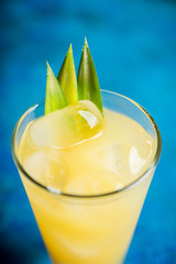 Pineapple cocktail in highball glass. Selective focus. Shallow depth of field.