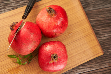Fototapeta na wymiar Whole pomegranate fruits