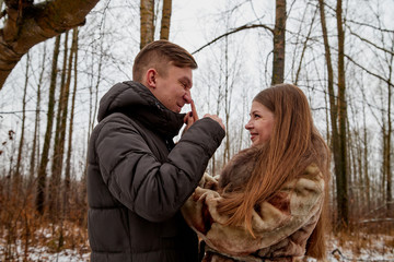 Romantic couple in love on autumn or winter walk