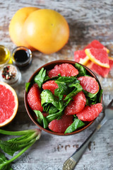 Fresh juicy salad with spinach and grapefruit. Diet salad. Selective focus. Macro.