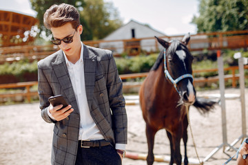 Horse theme. Businessman with a horse. Man in a suit