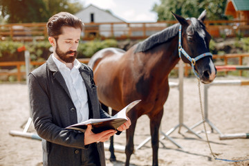 Fototapeta premium Horse theme. Businessman with a horse. Man in a suit