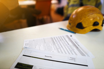 Defocused personal protective equipment safety helmet head protection placing on the table with...