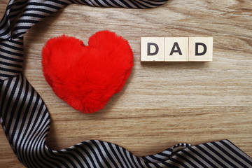 Happy Father's Day copcept with DAD alphabet letter with space copy on wooden background