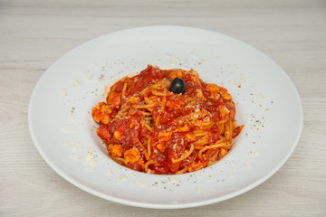 red spaghetti with olives