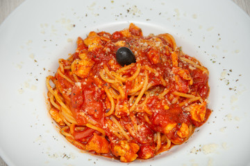 red spaghetti with olives
