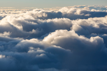Aerial view of clouds seen from the plane window