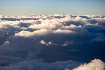Aerial view of clouds seen from the plane window