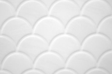 Fototapeta premium Texture of beautiful white tiles with a semicircular pattern