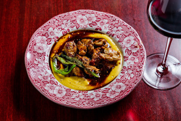 Sweet sheep meat with hummus. The cuisine of Tel Aviv.