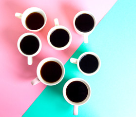 many cups of coffee on a colored background. Good morning coffee break concept. Flat lay top view composition.