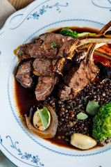 Rack of lamb with vegetables. The cuisine of Tel Aviv.