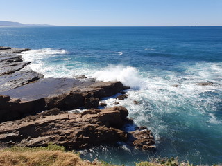 waves crashing on rocks