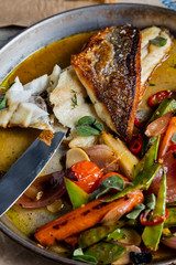 White fish with vegetables. The cuisine of Tel Aviv.