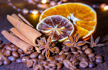 Fototapeta na wymiar Coffee beans with citrus cinnamon sticks and star anise