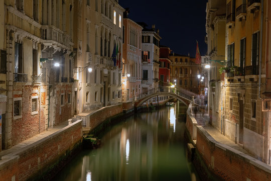 Beautiful photo of Venice at night. Light from the lanterns erupts in the canals of Venice
