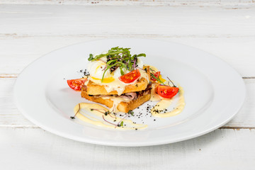 Fresh greens egg sandwich on a white plate